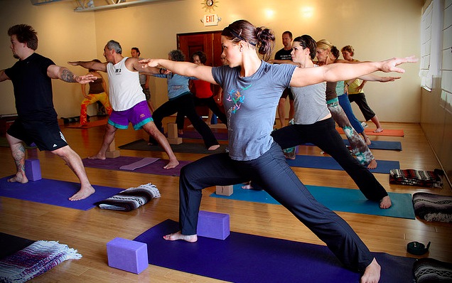 YogaWarrior Girl doing yoga warrior pose