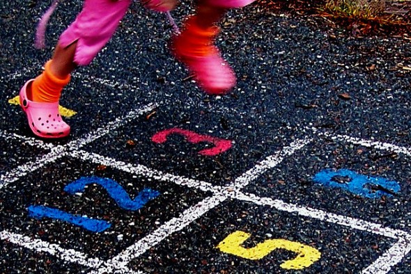 Why playing is good for us Girl Playing Hopscotch