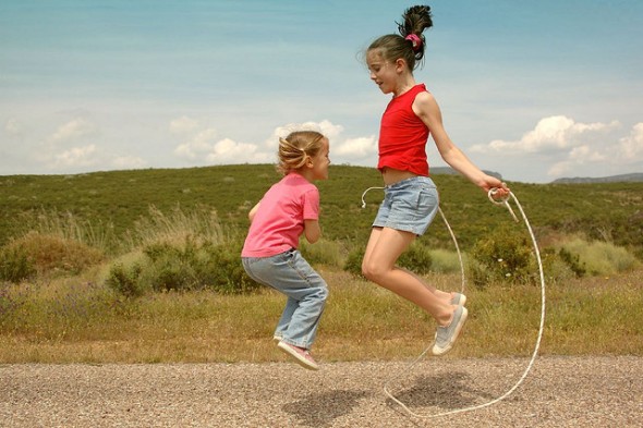 Playtime is back! Two Girls Playing Jump Rope, Exercising